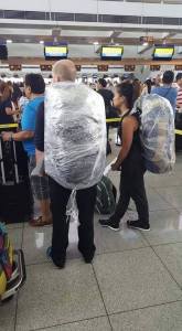 Airline passengers wrap their bags with plastic to avoid bullets being planted (by EXTORTION accomplices) that would then be DISCOVERED by security x-ray machines.